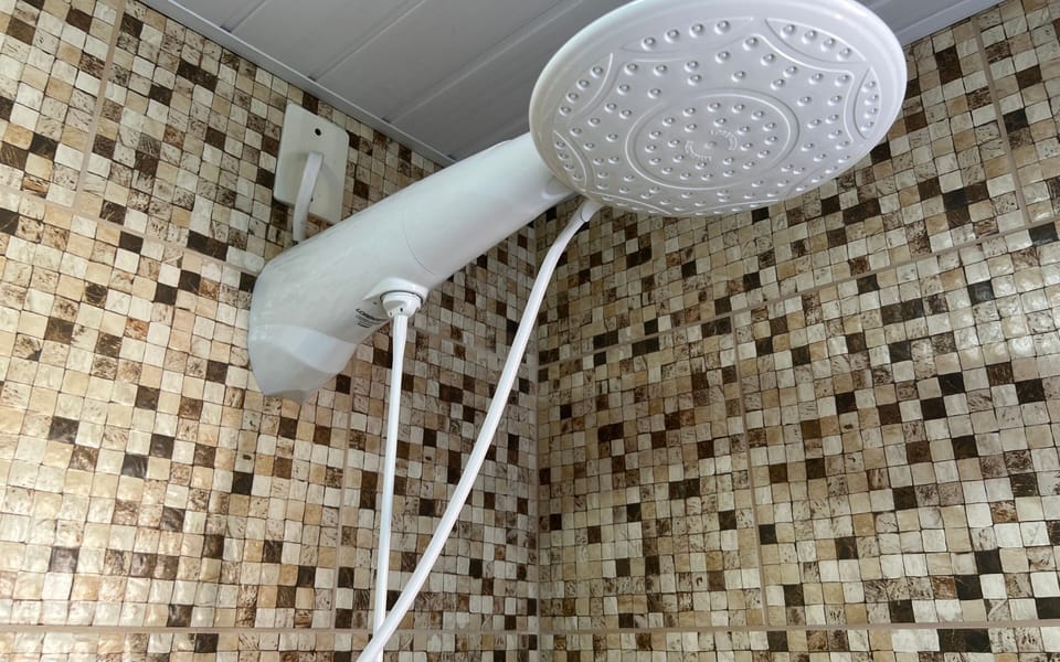 Superior Suite, 1 Queen Bed | Bathroom amenities | Shower, rainfall showerhead, towels, soap