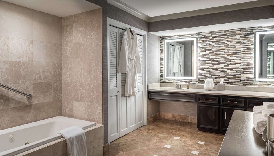 Suite, 1 King Bed, Non Smoking | Bathroom | Shower, free toiletries, hair dryer, towels