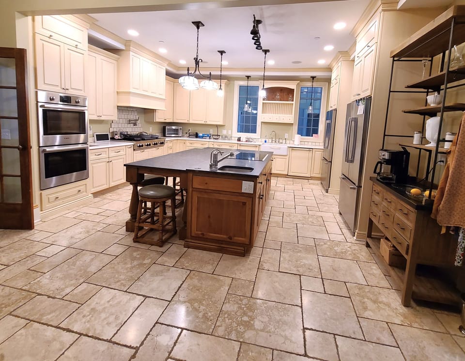 Island seating and Additional cooking in Island, with sink.