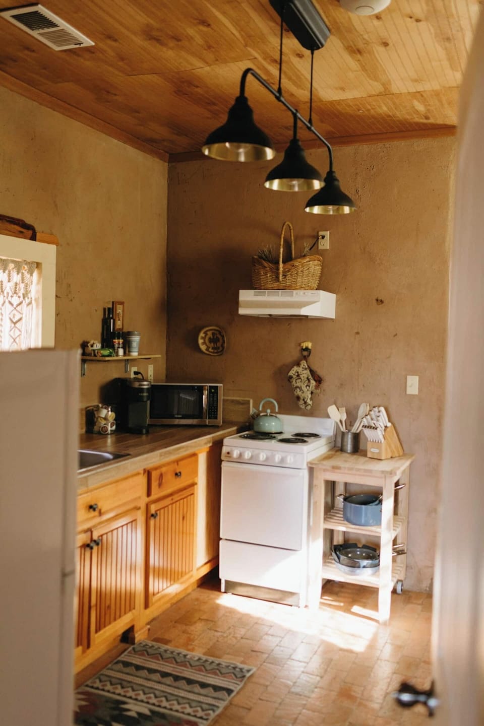 The small kitchen has been thoughtfully designed and stocked with quality cooking tools so you can enjoy home-made meals during your stay