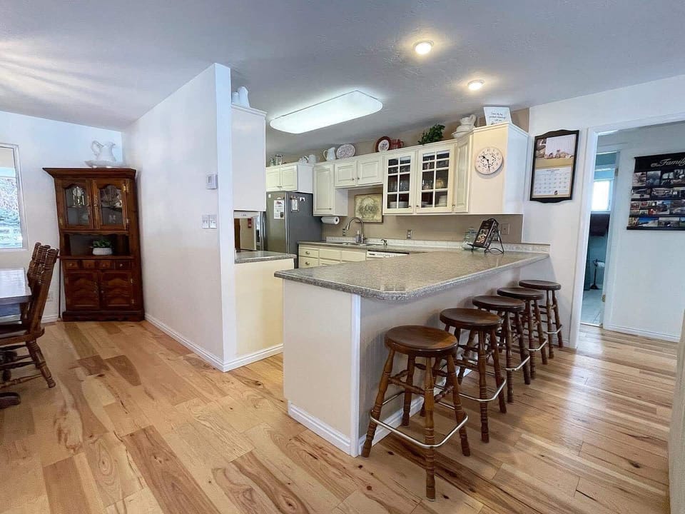 The kitchen offers ample seating and counter space, ideal for entertaining or casual meals.