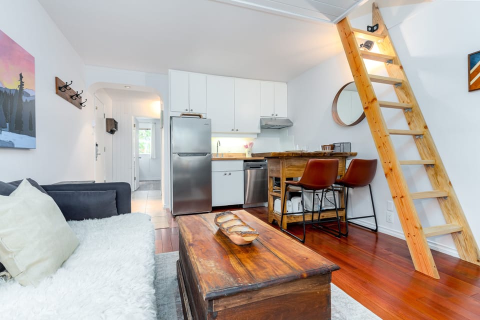 Living Room - Open space to kitchen, wide comfortable couch (optional sleeping surface), solid ladder leading to loft.