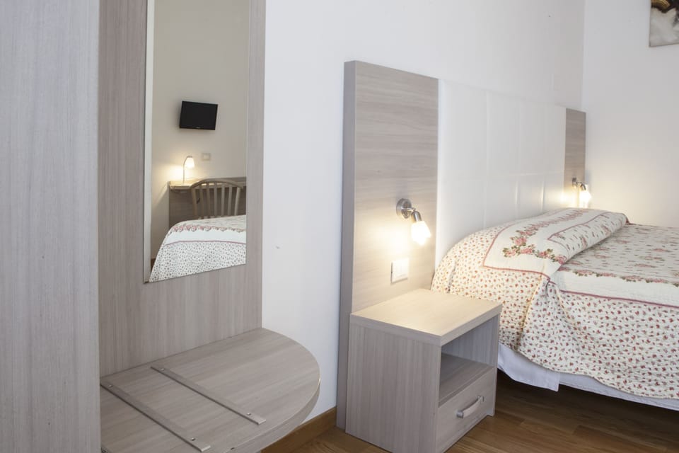 Down comforters, memory foam beds, in-room safe, desk