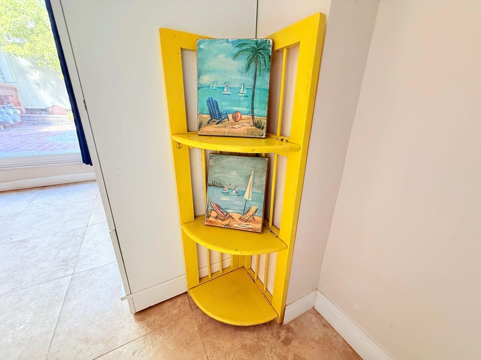 Bright yellow corner shelf to your stay