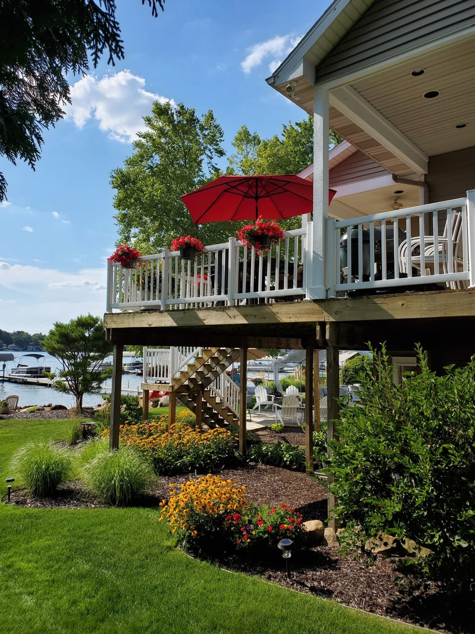North side. Upper deck with a grill, lounging furniture and outdoor dining.