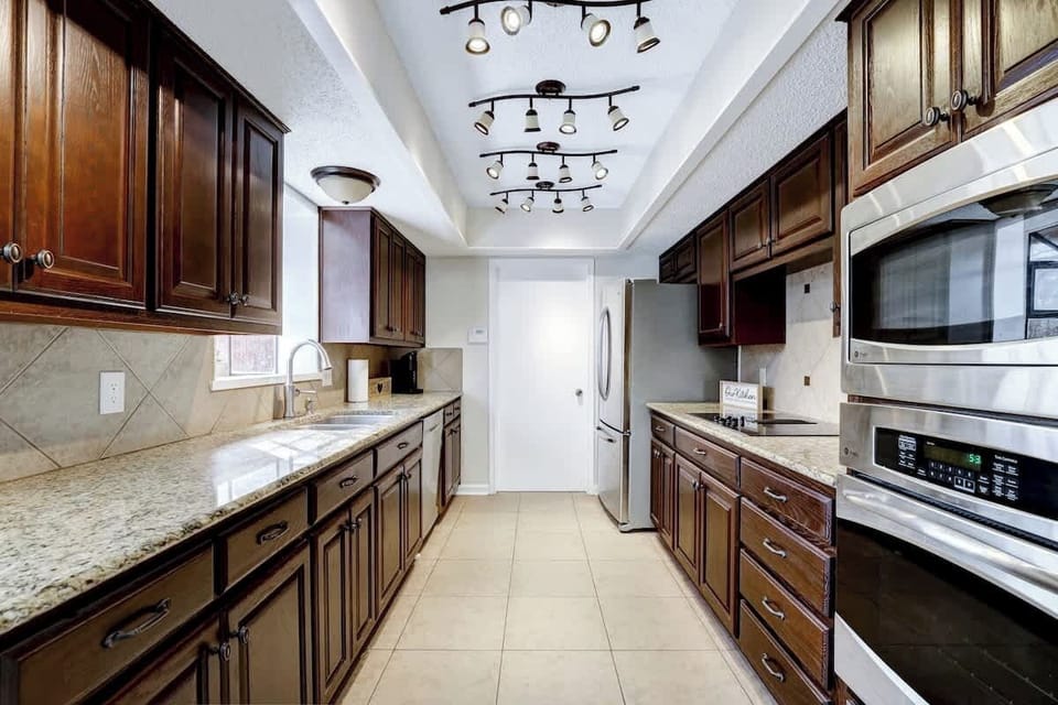 Full kitchen with fully functioning stove, oven, microwave and refrigerator. 