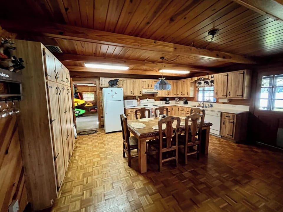 Full kitchen with fridge, oven, stovetop, microwave, coffeemaker, & dishwasher.
