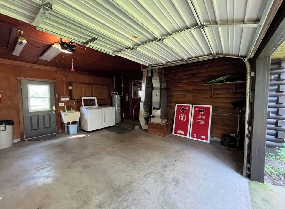 Kitchen door shown in the middle. Cornhole game available for guests to enjoy.
