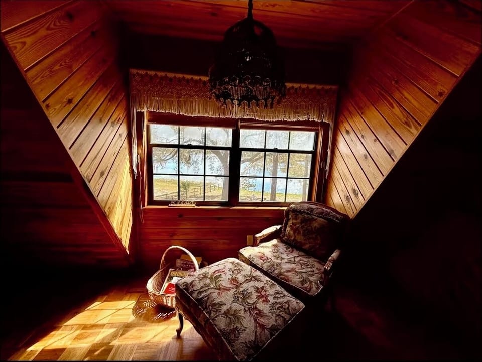 Relaxing spot to sit and read from upstairs room with view to lake.