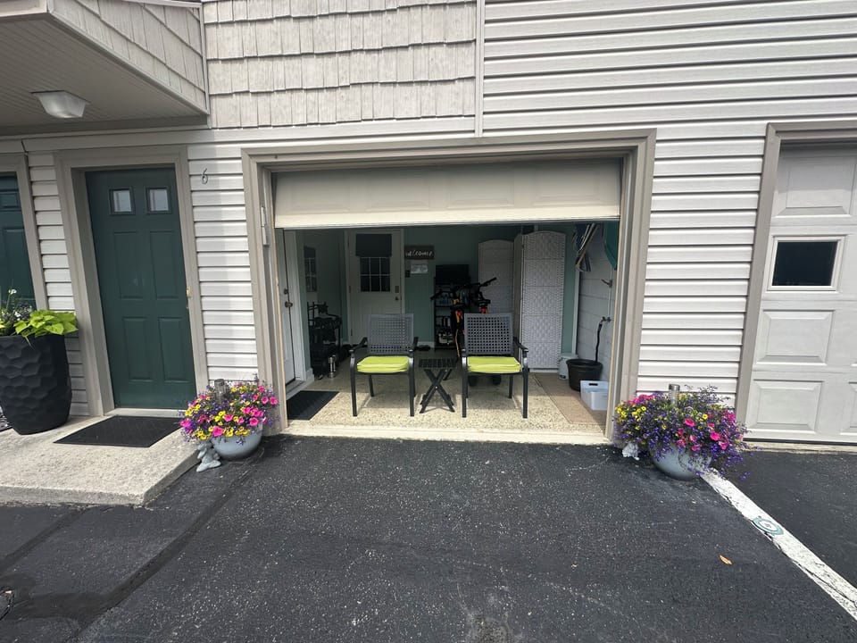 Garage Door Main Entrance to Your Suite!  Parking Space in front of Suite
