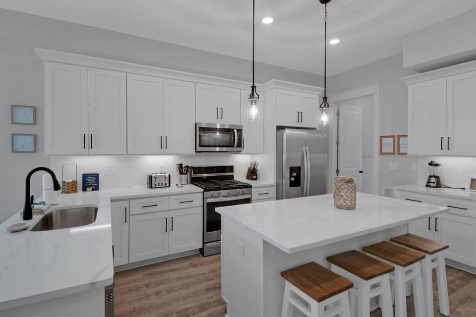 This brand new kitchen is fully stocked with everything you will need during your stay, as well as beautifully appointed with stainless steel applianc
