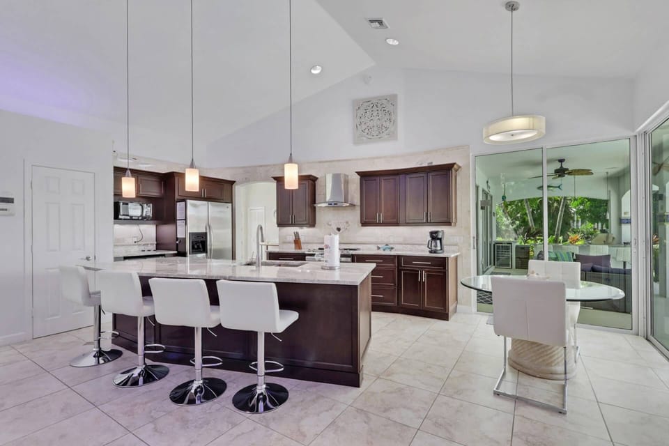 The gorgeously designed kitchen is open to the family room, perfect for spending time together.