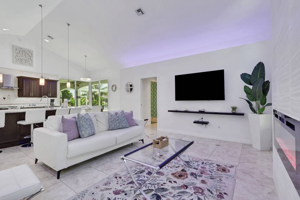 Open to the kitchen, at the back of the home, you'll find the dramatic, vaulted family room.
