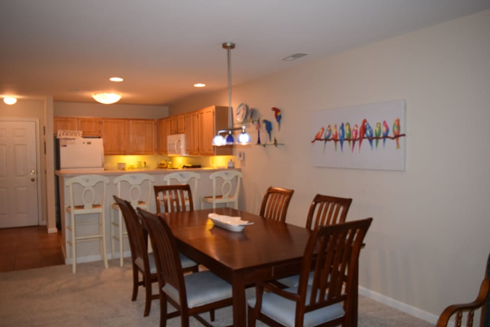 Spacious, open floor plan. Plenty of seating between breakfast bar and dining table.