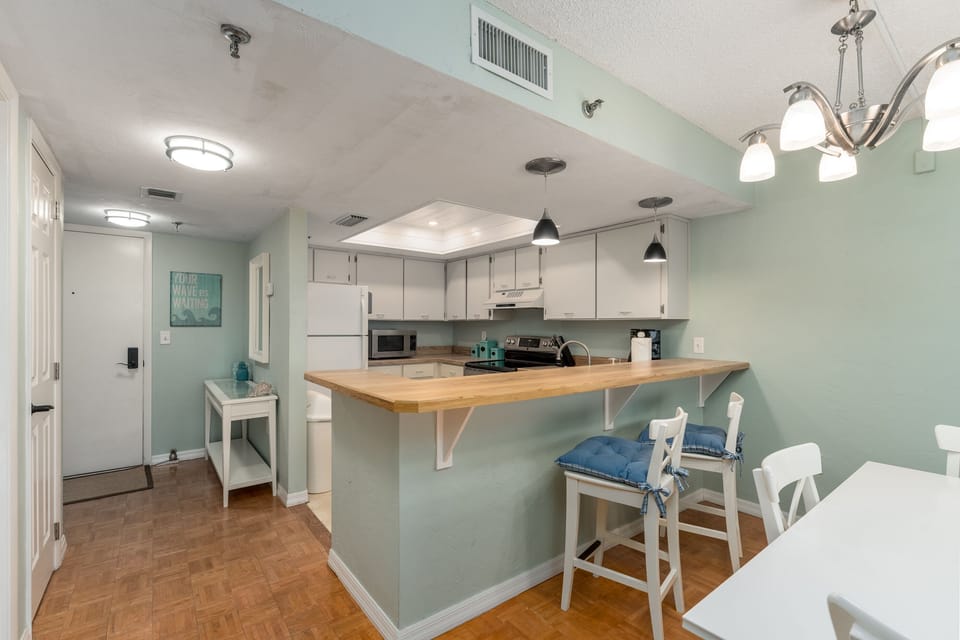 Seating for 3 at the table with 2 extra bar stools