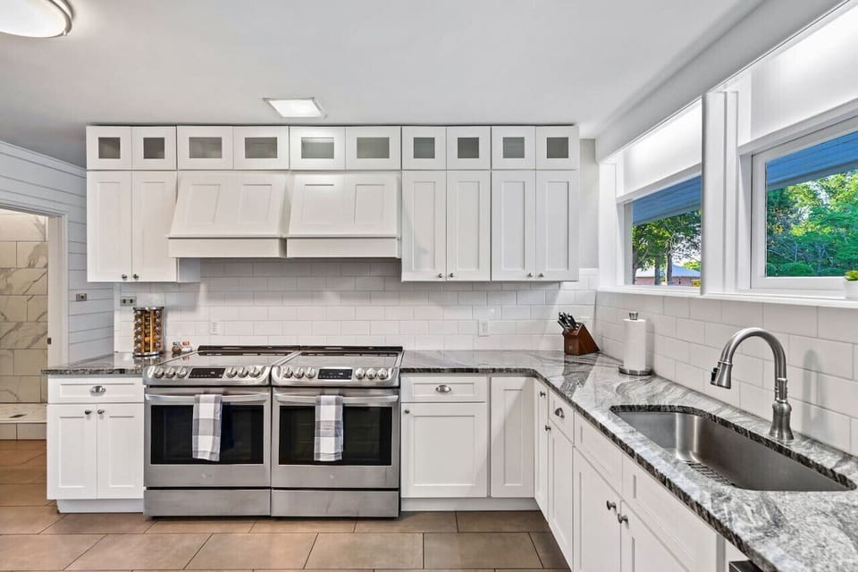 Large kitchen with 2 stoves and large refrigerator/freezer