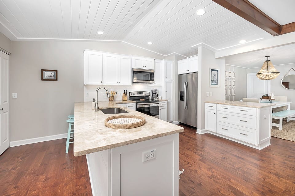Kitchen features a breakfast bar with lots of seating space