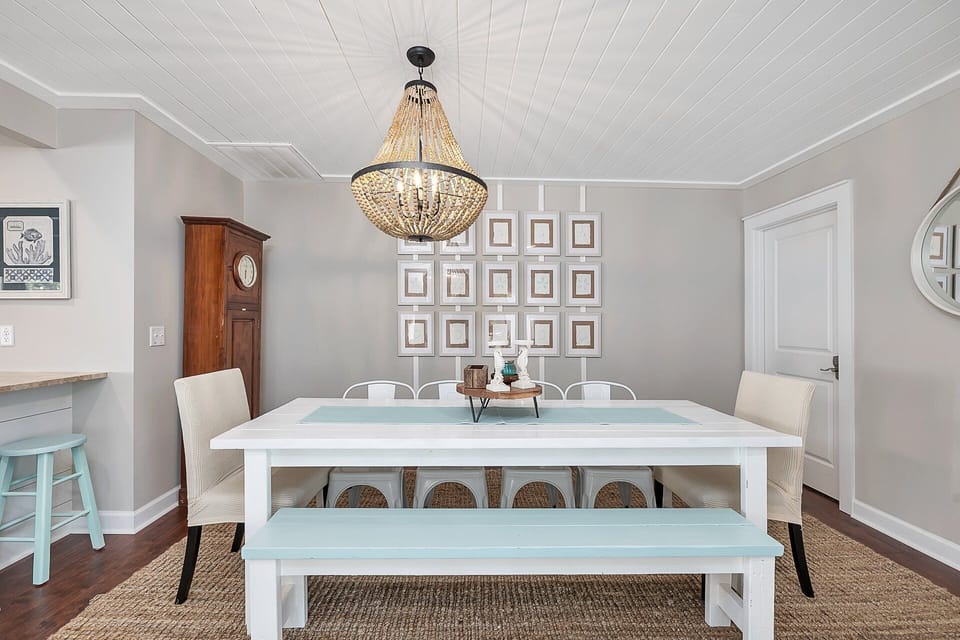 Dining table seats ten with additional seating at the breakfast bar