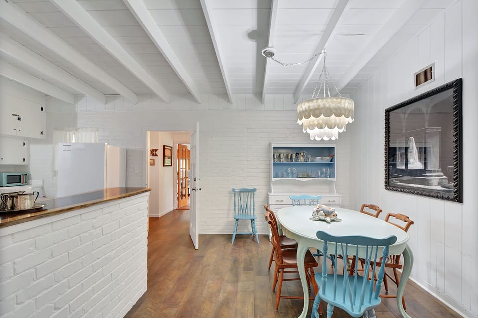 Dining Area – Open Layout with Coastal Style - Whether you're prepping snacks for the beach or winding down after a conference at the Jekyll Island Convention Center, this open-concept space keeps everything within reach—and beautifully lit.