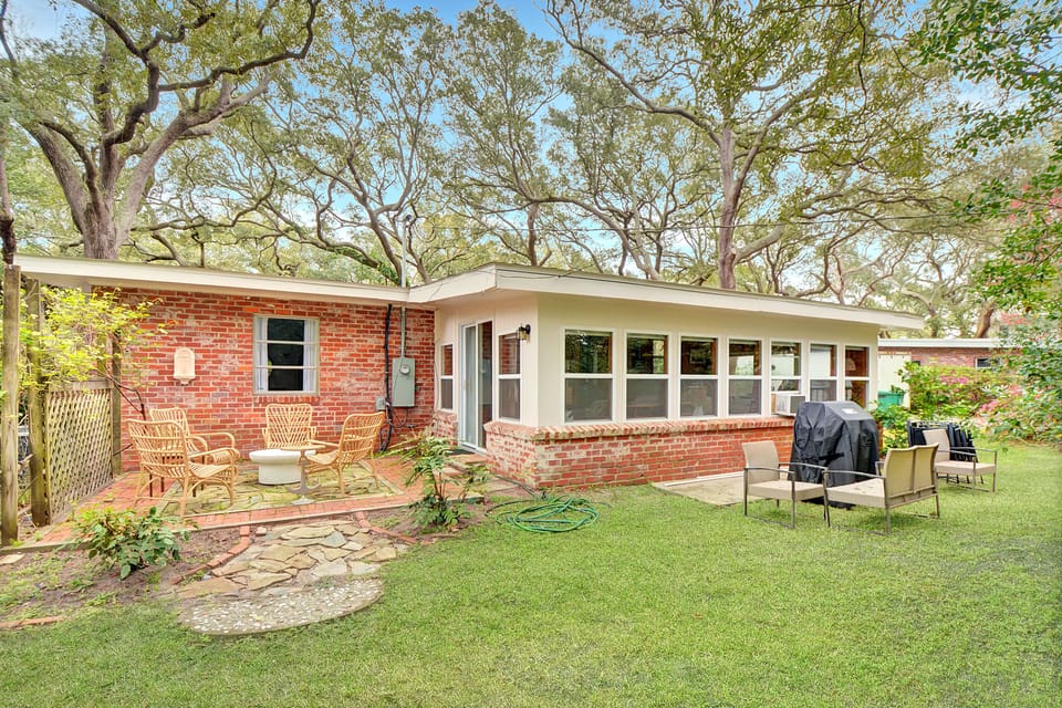 Back Patio – Private Yard on Jekyll Island - Grill under the oaks—this backyard at Mocama offers the kind of Jekyll Island peace you can’t book by the hour.