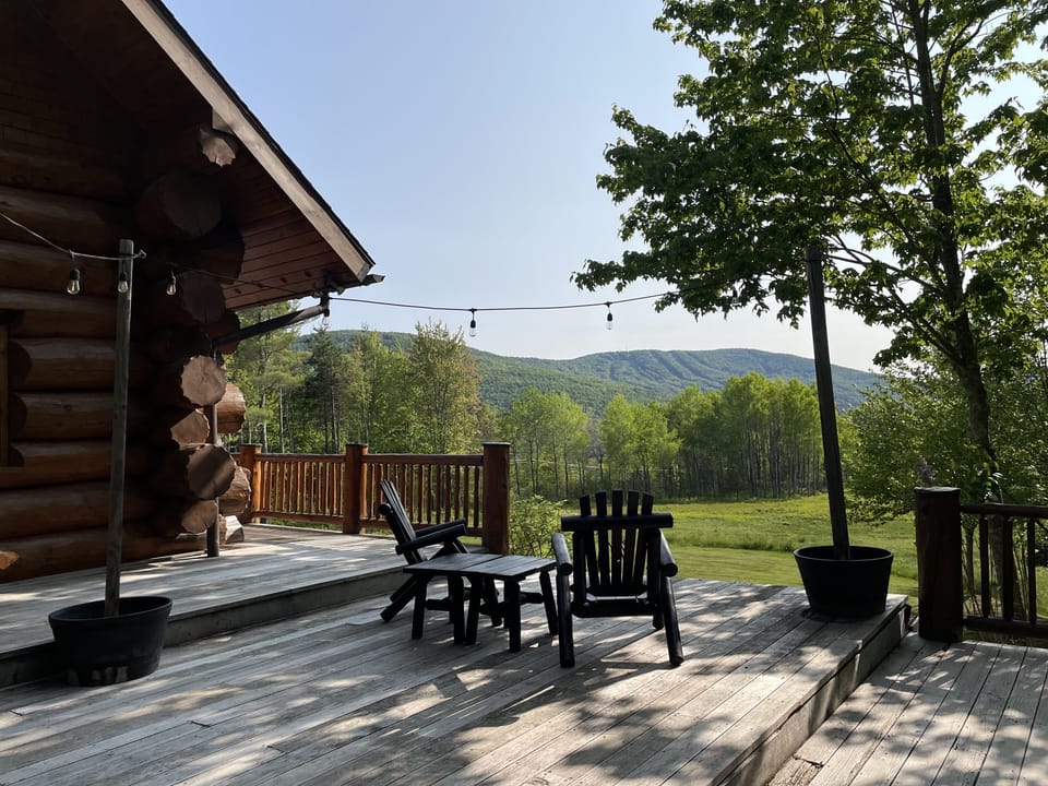 View from deck facing towards ski resort and sunset.