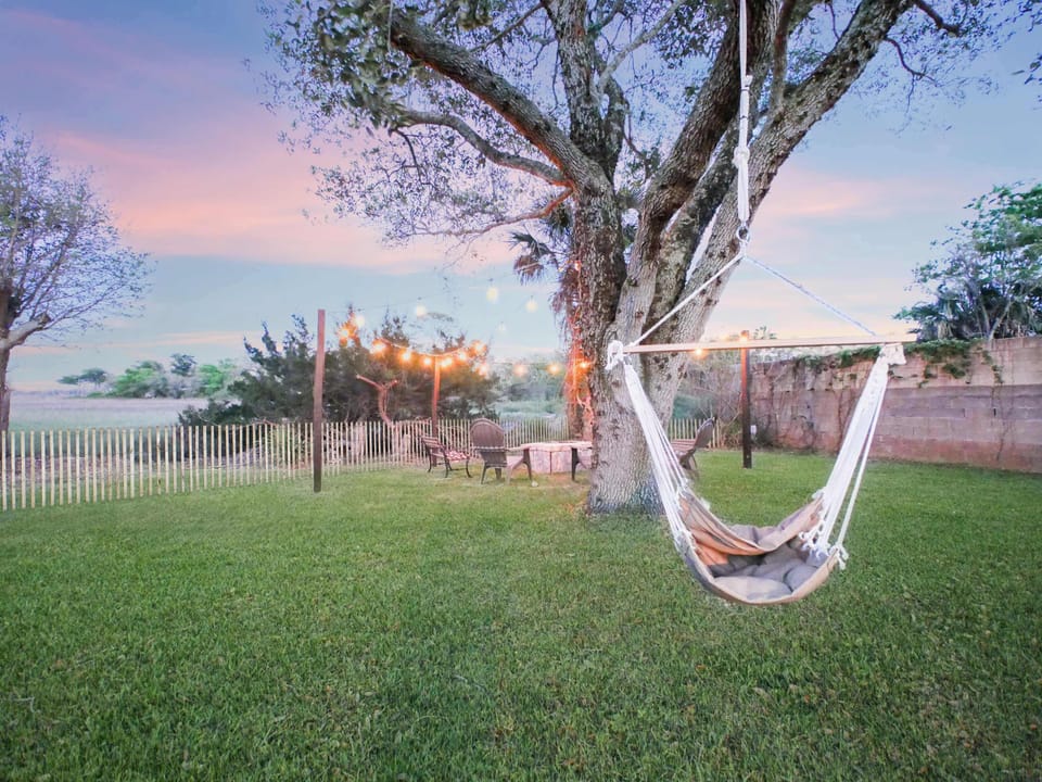 Swing under under the large birch tree, congregate around the fire