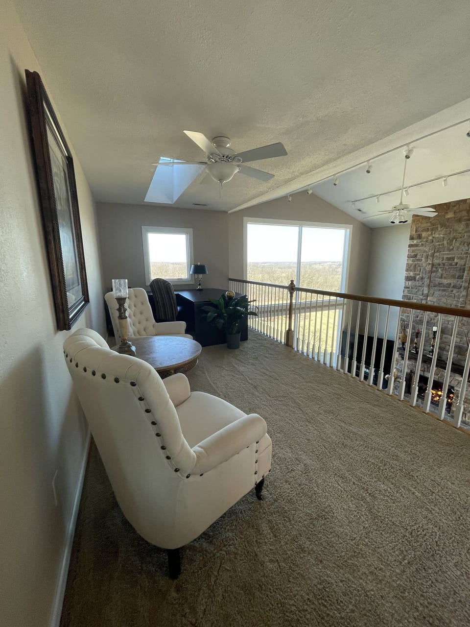 Sitting area upstairs with desk and awesome view of Reigal Dairy Farm