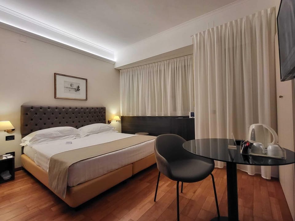 Superior Double Room | Minibar, in-room safe, individually decorated, desk