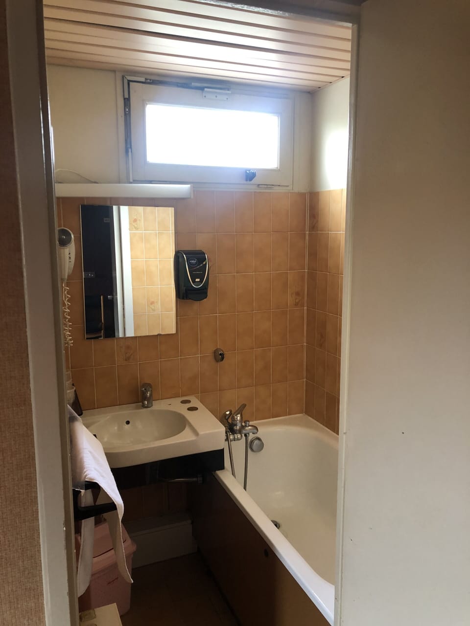 Bathtub, hair dryer, towels, soap