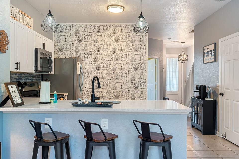 Modern full kitchen with bar seating for 4