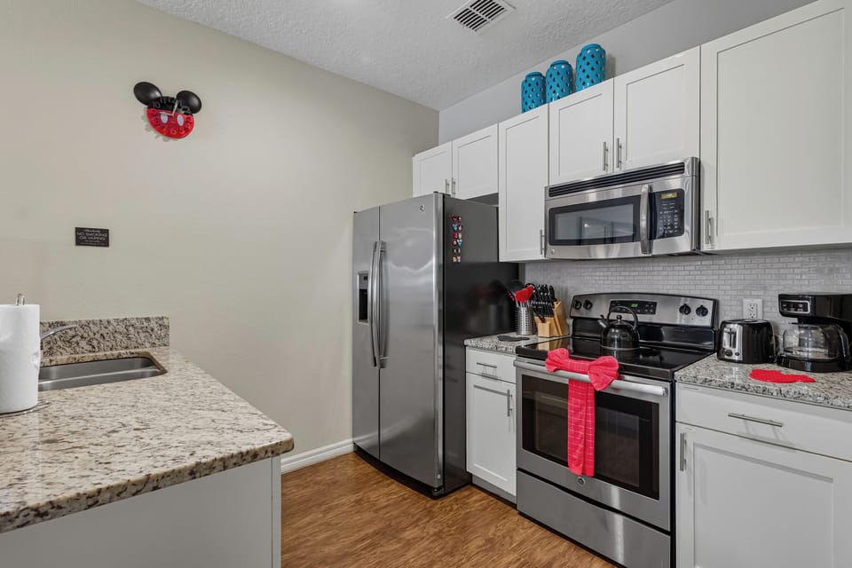 Bright, fully equipped kitchen-cheerful Disney touches make cooking a pleasure
