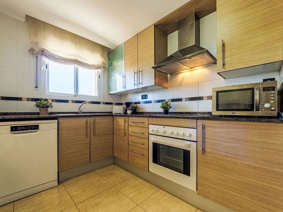 Kitchen, Major Appliance, Kitchen Appliance, Cabinetry, Flooring, Countertop, Wood, Interior Design, Floor, Furniture