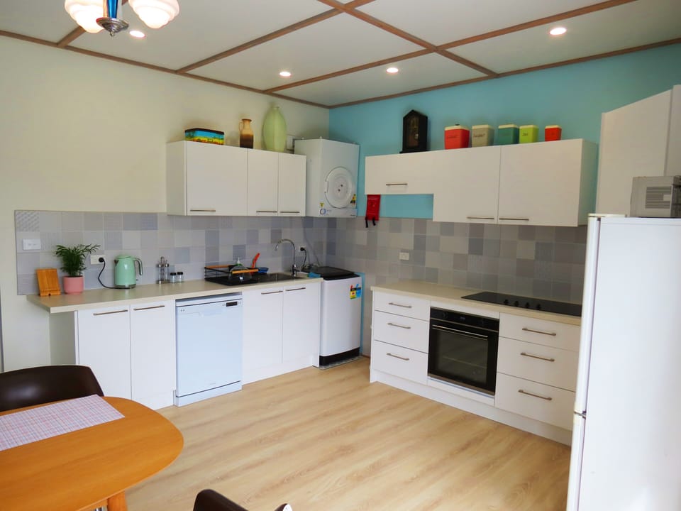 full kitchen incorporates laundry as well