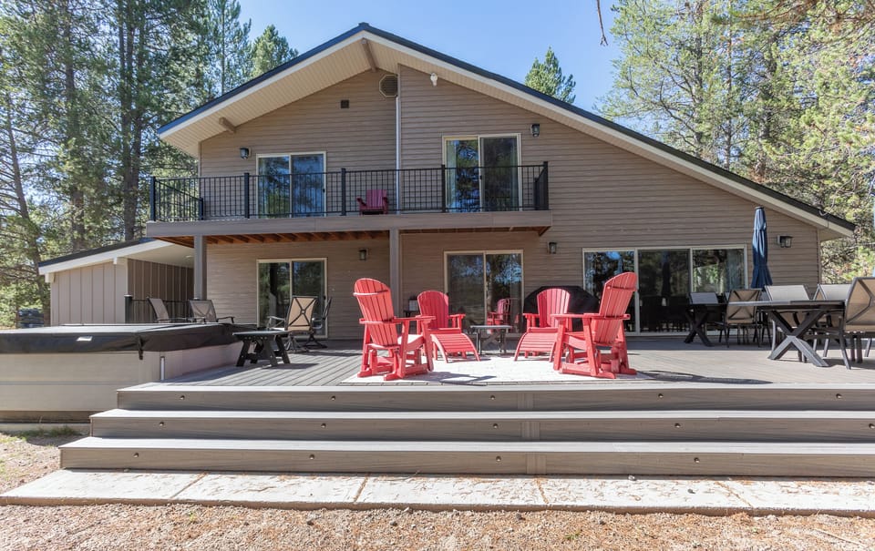 The large deck at the back of the house offers lots of outdoor seating, a BBQ, and a hot tub.  