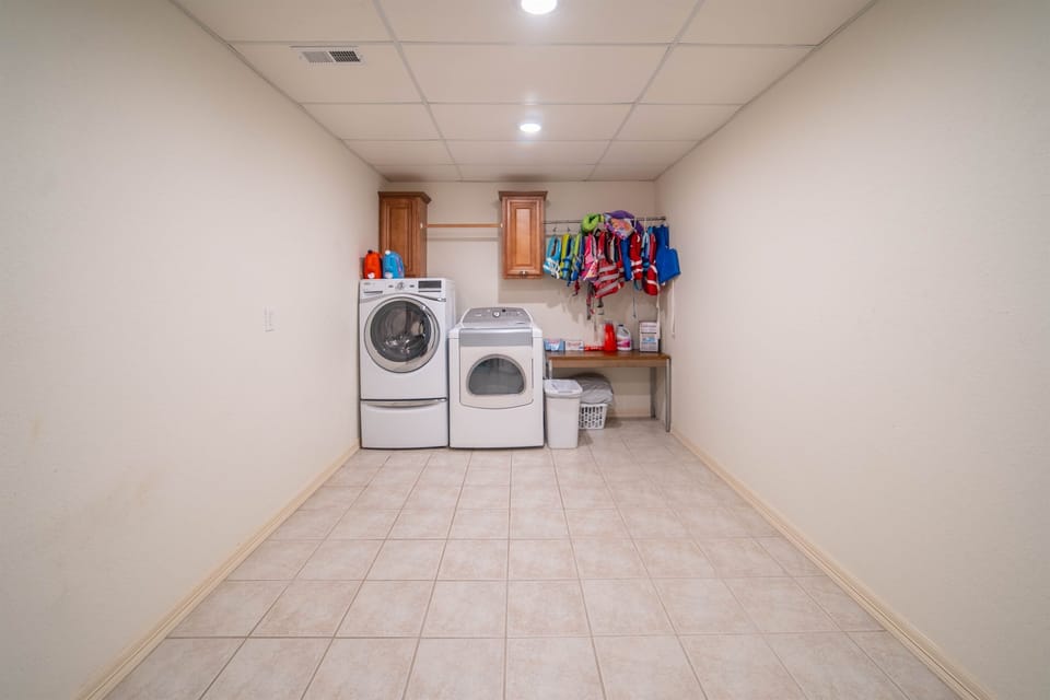 Large Storage Room complete with washer and dryer as well as life jackets makes lake life really easy.