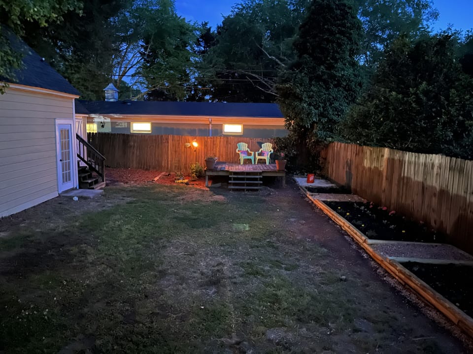 Backyard with regulation horseshoe pit 