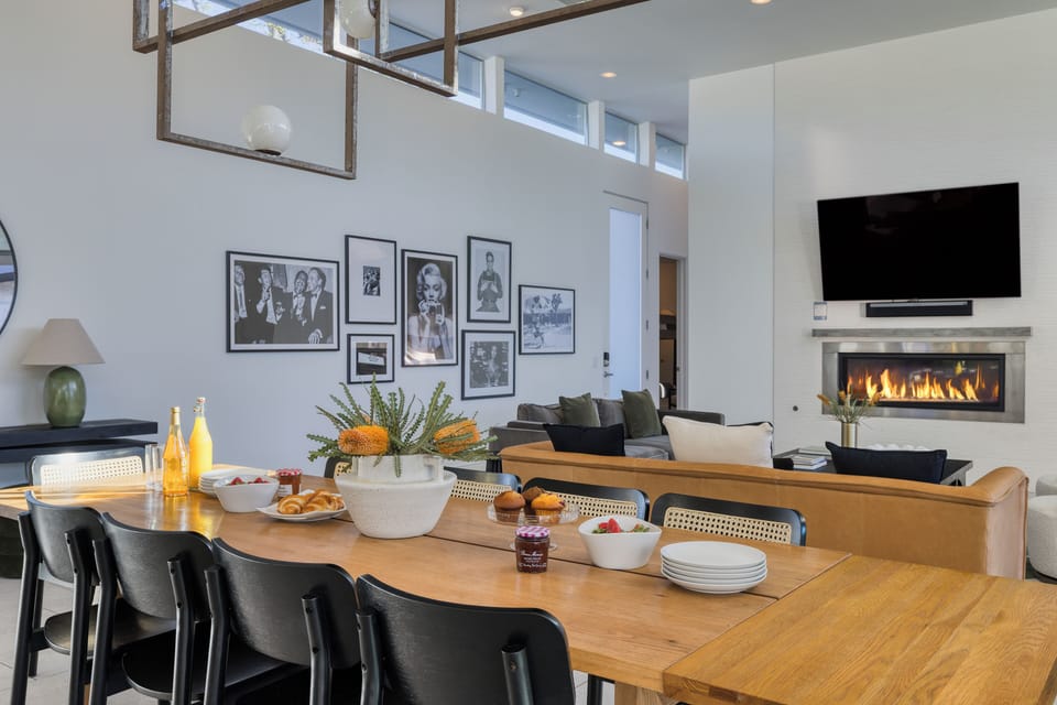 Dining area with a large wooden table, perfect for gatherings.