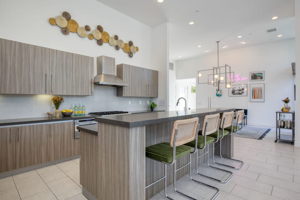 Additional barstool seating at the kitchen counter.