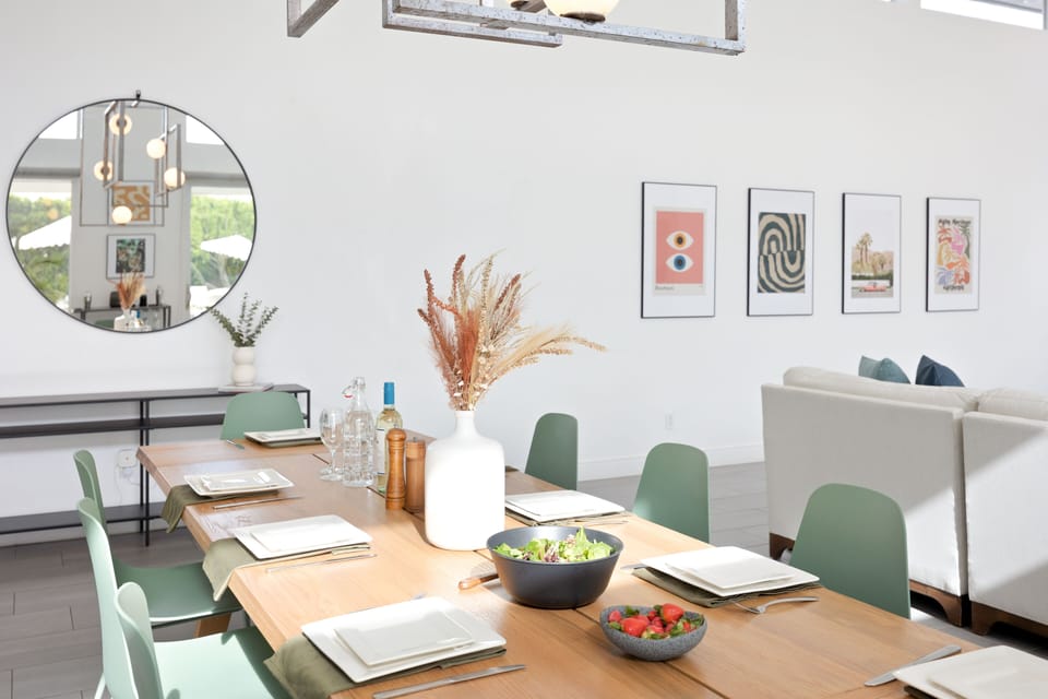 Kitchen is fully-equipped with table settings.