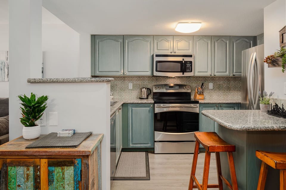 Whip up meals with ease in the fully equipped kitchen with stainless steel appliances.