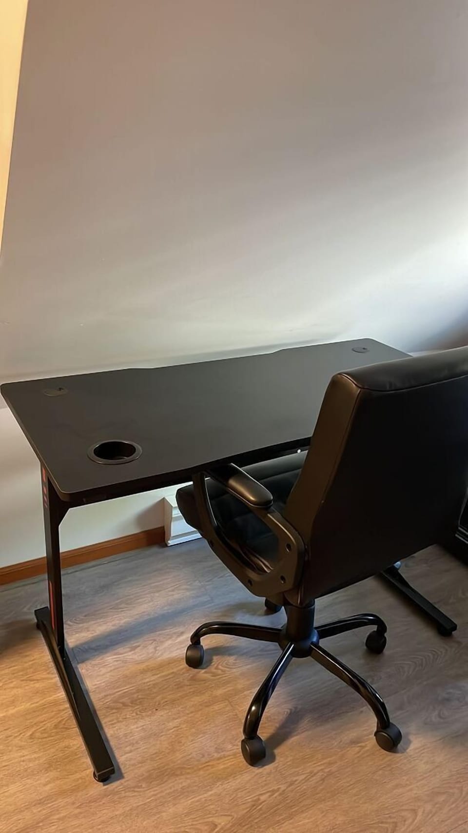 A dedicated desk and chair create the perfect remote work setup.