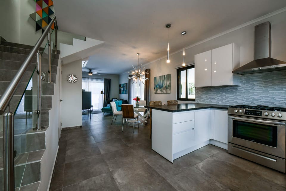 First floor with kitchen, dining, and living room.  Stairs lead to bedrooms.