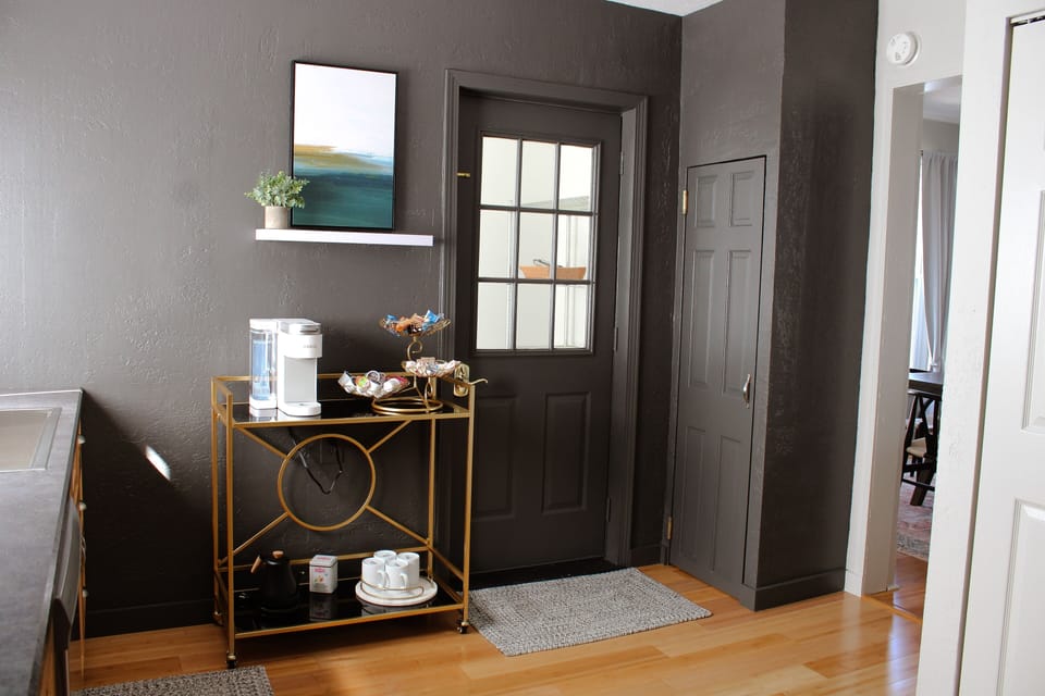 The kitchen has a complimentary coffee cart. The door leads to the back porch.
