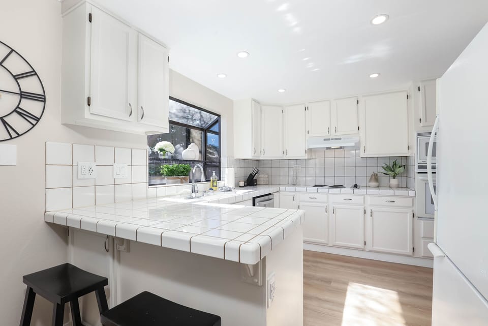 Wake up to a warm cup of coffee in this bright energetic kitchen. 