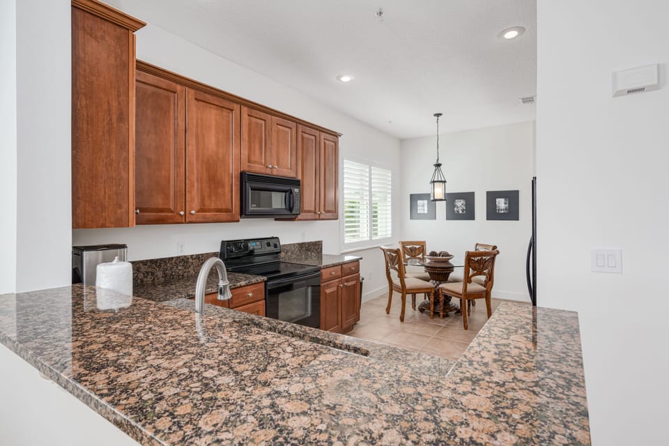 The kitchen is spacious with a breakfast nook.