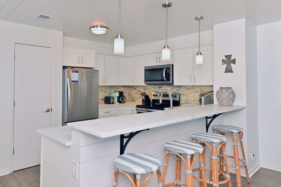 Spacious kitchen with bar seating, perfect for casual meals and gathering