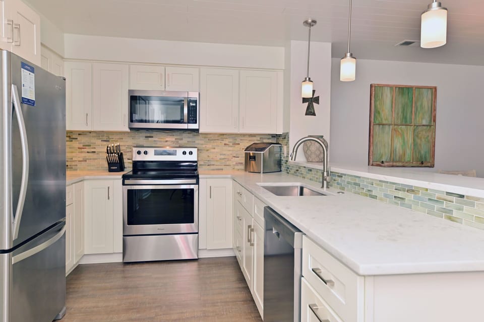 Bright kitchen with stainless steel appliances and generous counter space