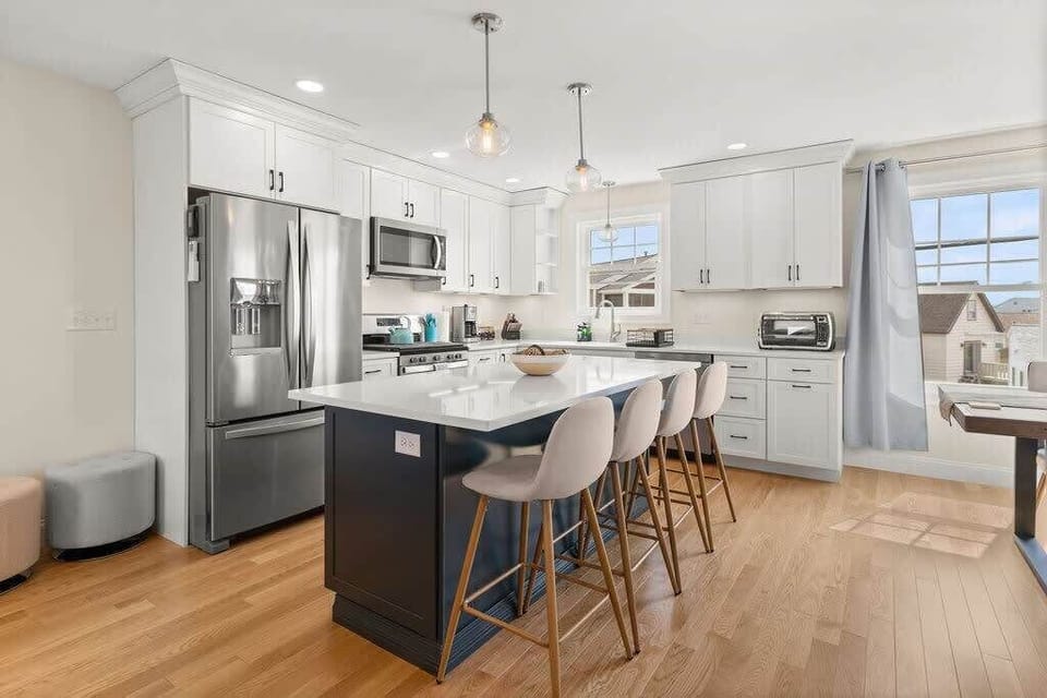 Open Kitchen, living room and dining room with high-end finishes/appliances and gas fireplace