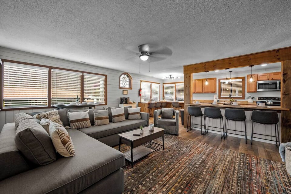 Our open floor plan designer living/kitchen space features West Elm furnishings