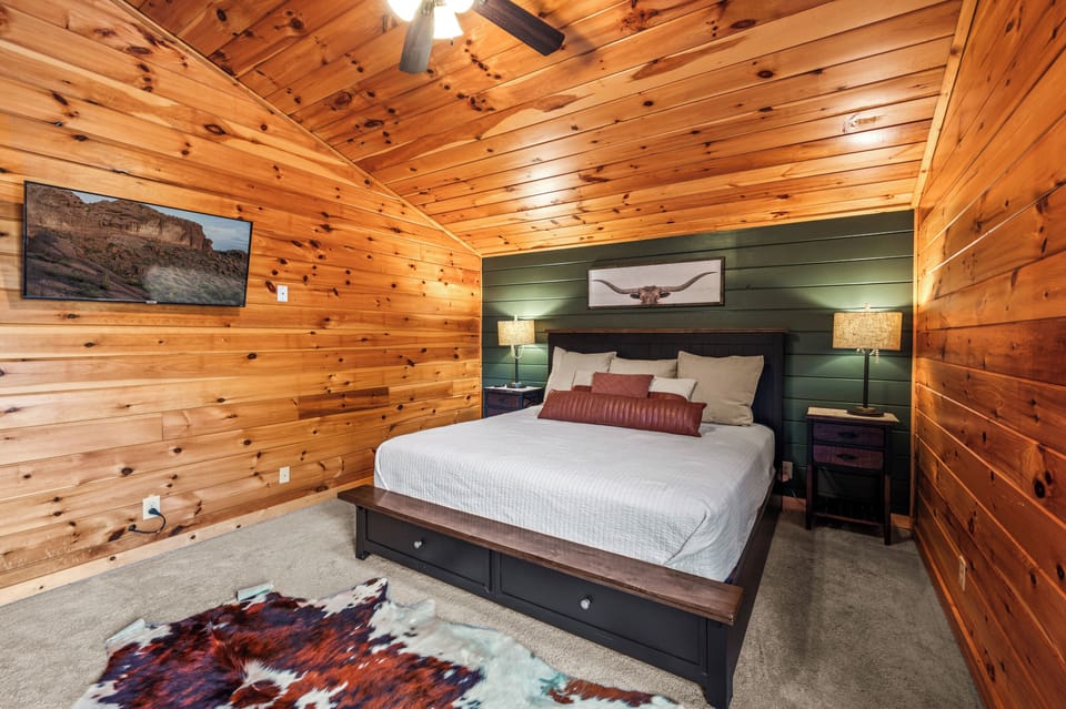 Primary bedroom with king bed, Smart TV, and ensuite bathroom